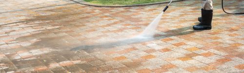 Outdoor floor cleaning with a pressure water jet on street